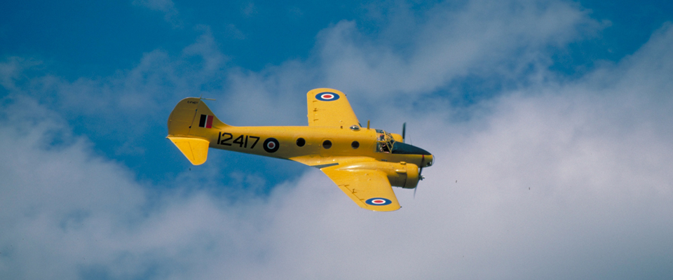 yellow plane in sky